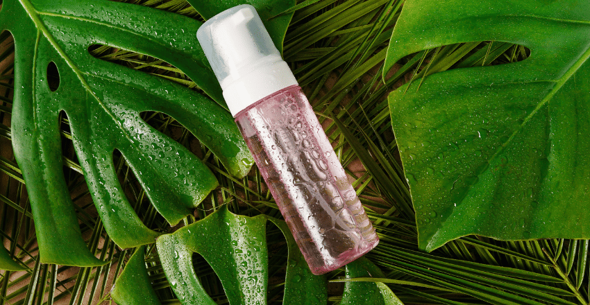 Pouring cleansing oil into an open palm