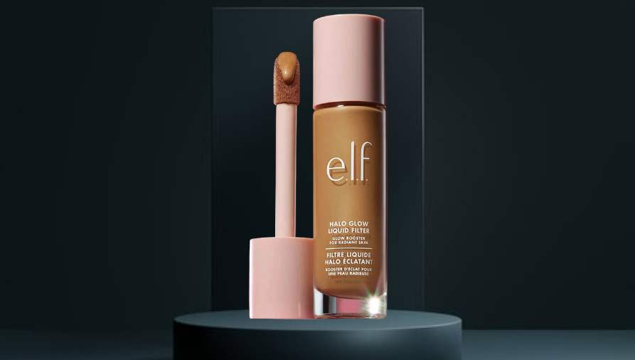 Bottle of liquid glow foundation on a vanity surface